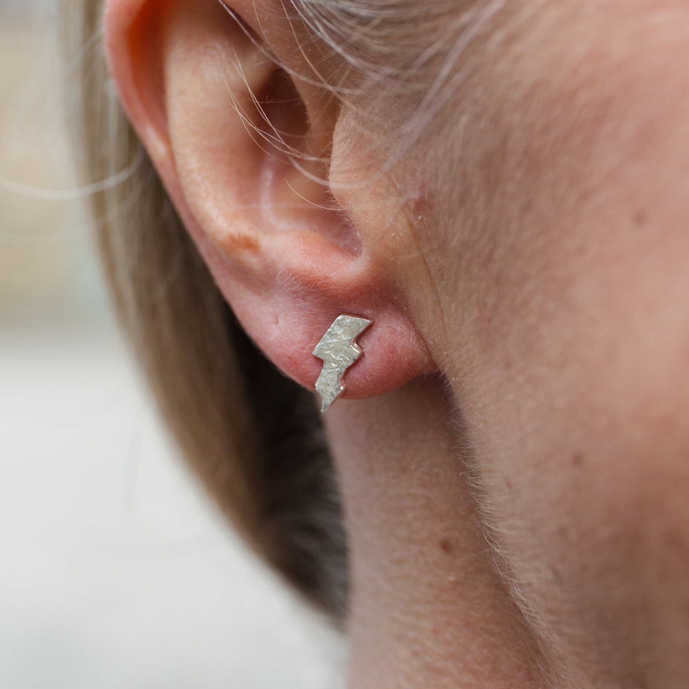 
                  
                    sterling silver textured lightning bolt studs worn by Lucy Kemp Jewellery
                  
                