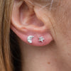 sterling silver textured mini mismatch moon and star studs worn, handmade by Lucy kemp Jewellery