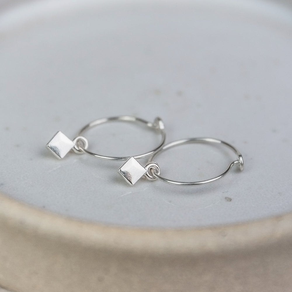 
                  
                    sterling silver diamond bead charm hoop handmade by Lucy Kemp Jewellery
                  
                