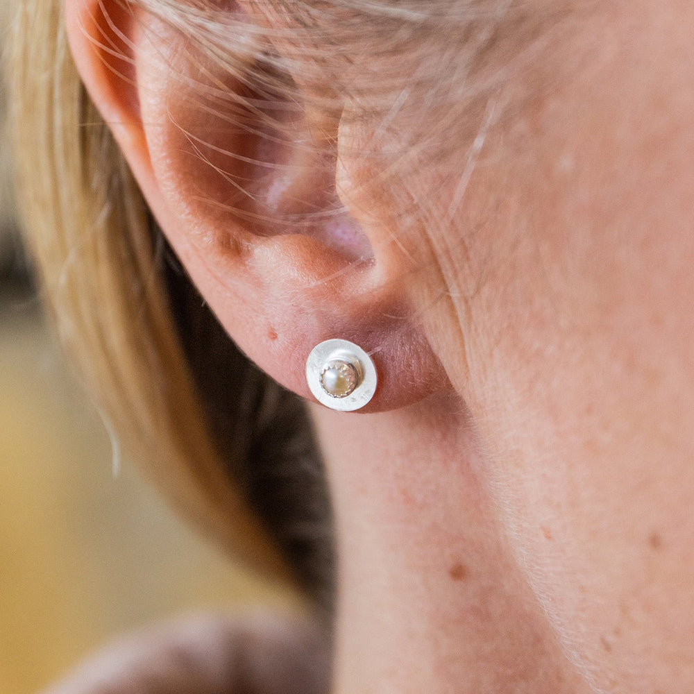 
                  
                    worn Pearl and sterling silver birthstone small disc studs by Lucy Kemp Jewellery
                  
                