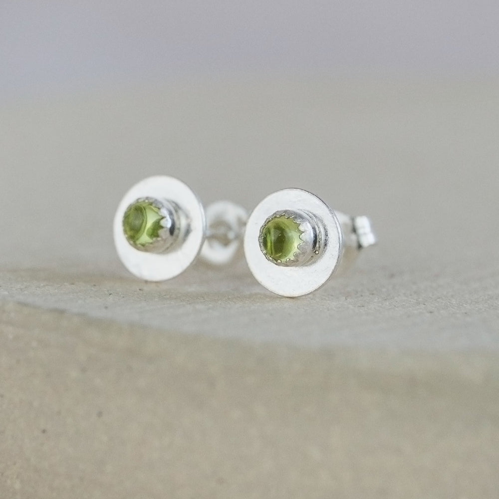 
                  
                    Peridot and sterling silver birthstone small disc studs by Lucy Kemp Jewellery
                  
                