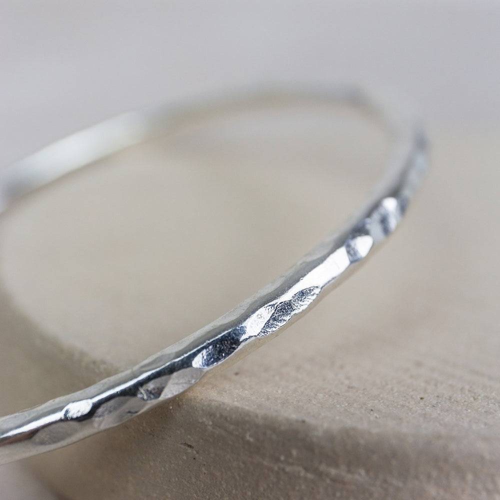 
                  
                    sterling silver thick hammered statement bangle handmade by Lucy Kemp Jewellery
                  
                