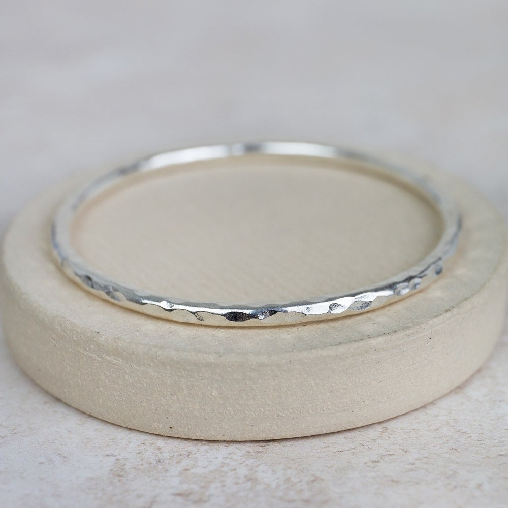 
                  
                    sterling silver thick hammered statement bangle handmade by Lucy Kemp Jewellery
                  
                