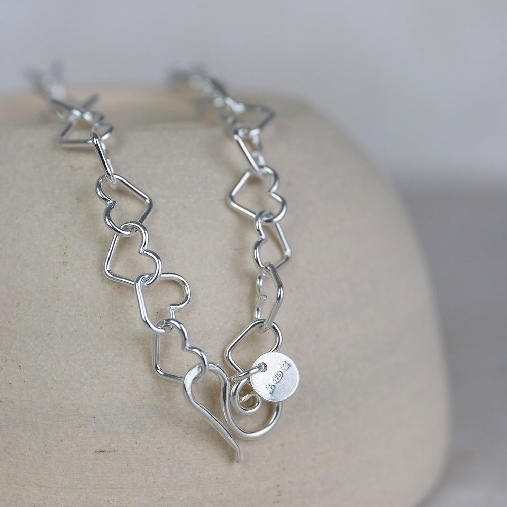 
                  
                    sterling silver geo heart link chain necklace handmade by Lucy Kemp Jewellery
                  
                
