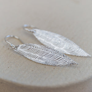 
                  
                    Sterling silver palm leaf textured earrings by Lucy Kemp jewellery
                  
                