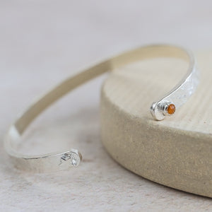 
                  
                    sterling silver and citrine with star charm birthstone cuff by Lucy Kemp Jewellery
                  
                