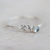sterling silver birthstone love knot ring by Lucy Kemp Jewellery with Aquamarine