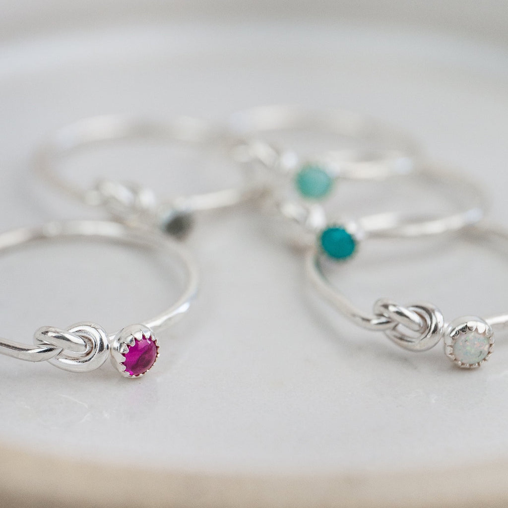 sterling silver birthstone love knot ring group shot 2 by Lucy Kemp Jewellery 