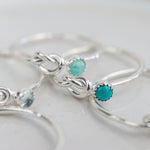 sterling silver birthstone love knot ring group shot by Lucy Kemp Jewellery 
