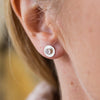 worn Rose Quartz and sterling silver birthstone small disc studs by Lucy Kemp Jewellery