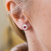 worn Ruby (SYN) and sterling silver birthstone small disc studs by Lucy Kemp Jewellery