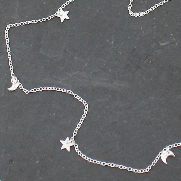 
                  
                    sterling silver short textured star and moon charm necklace by Lucy Kemp Jewellery
                  
                