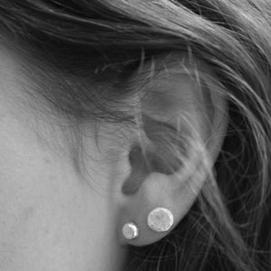 
                  
                    Recycled sterling silver medium and small nugget studs, handmade by Lucy Kemp Jewellery both sizes worn for comparison
                  
                