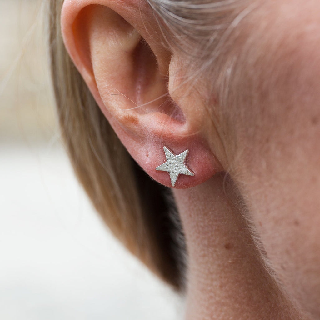 sterling silver textured star stud worn by Lucy Kemp Jewellery