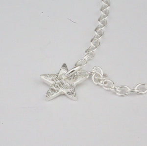 
                  
                    sterling silver star charm by Lucy Kemp Jewellery
                  
                