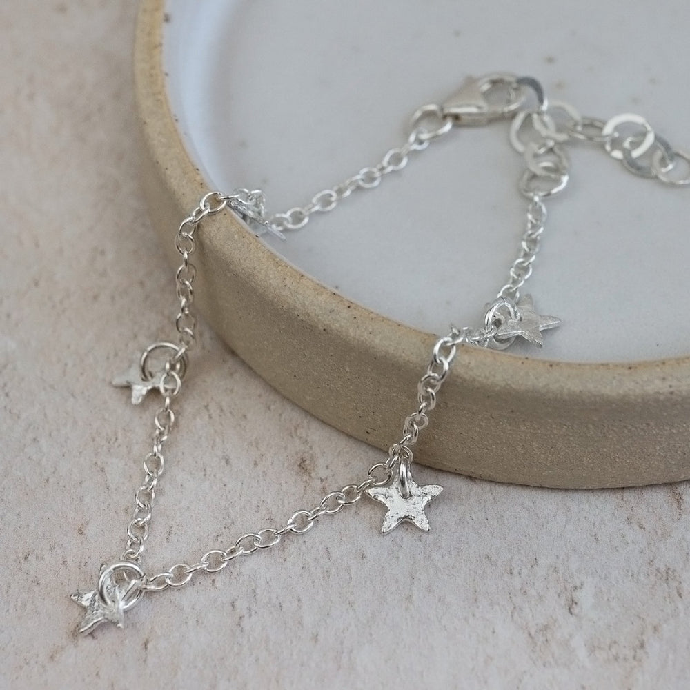 
                  
                    sterling silver star charm bracelet
                  
                