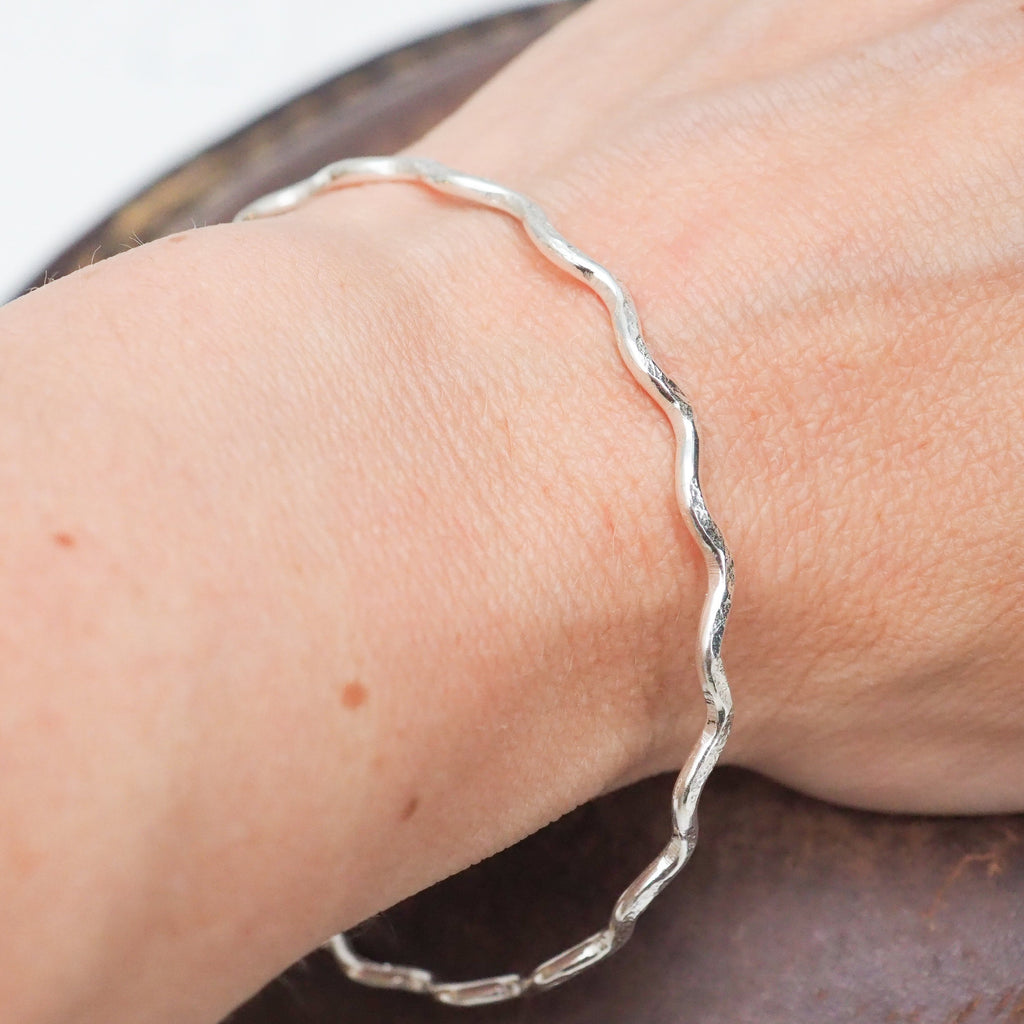 sterling silver swirl bangle handmade by Lucy Kemp Jewellery