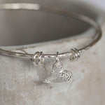 sterling silver textured tilted heart bangle by Lucy Kemp Jewellery