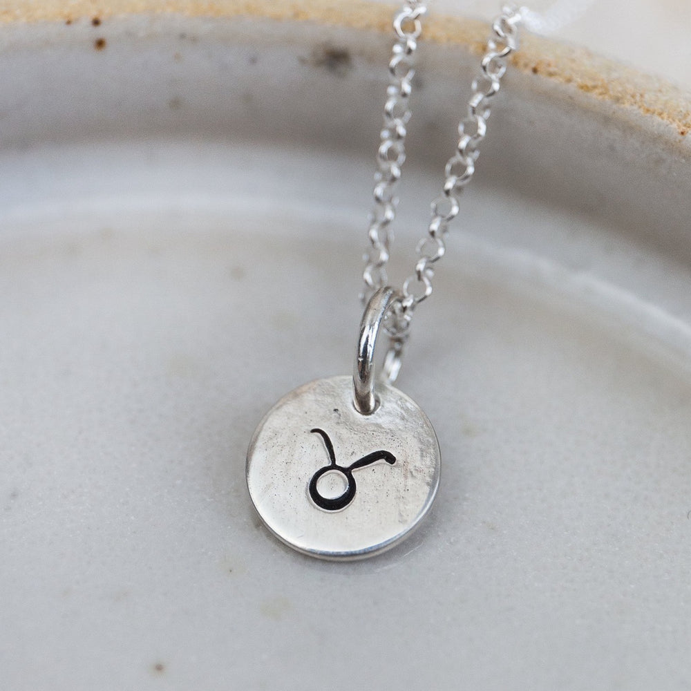 
                  
                    sterling silver personalised zodiac dinky pendant by Lucy Kemp Jewellery
                  
                