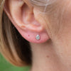 sterling silver mini raindrop stud worn, by Lucy Kemp Jewellery 