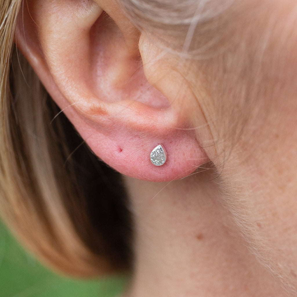 sterling silver mini raindrop stud worn, by Lucy Kemp Jewellery 