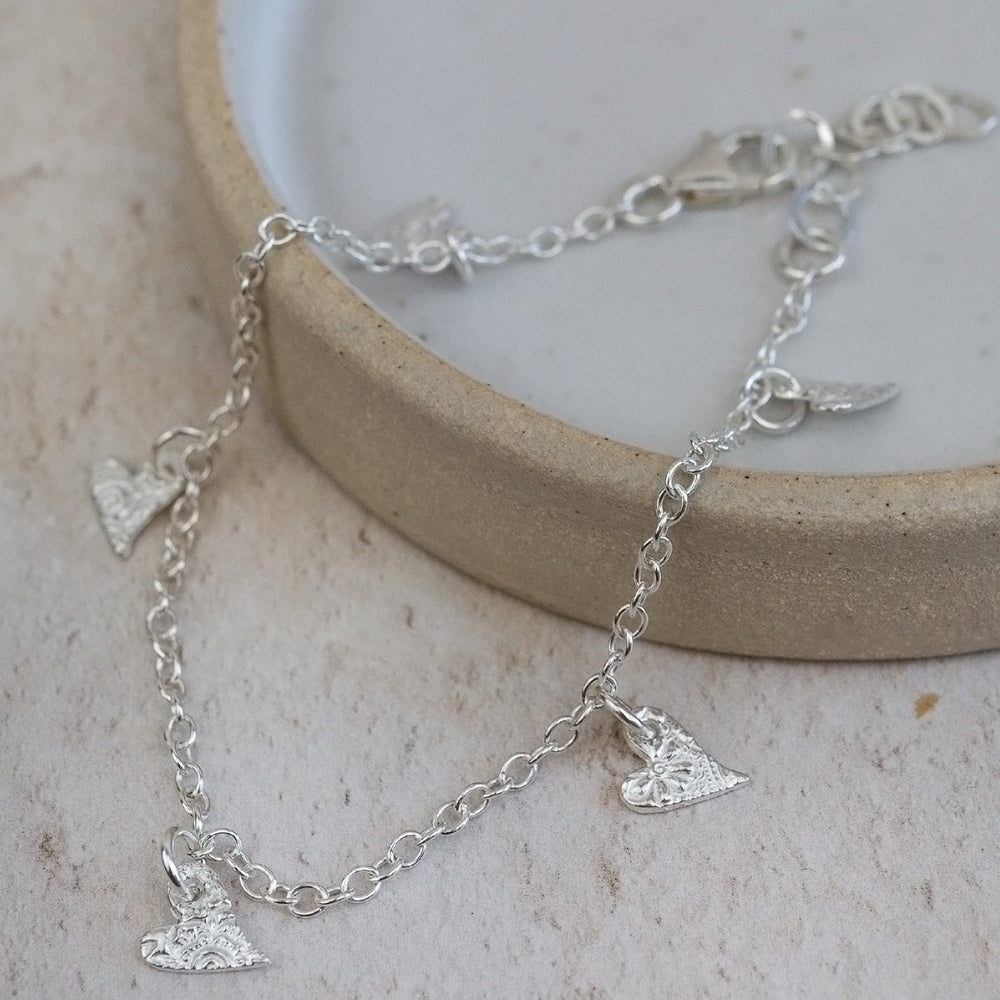 
                  
                    sterling silver textured tilted heart charm bracelet
                  
                