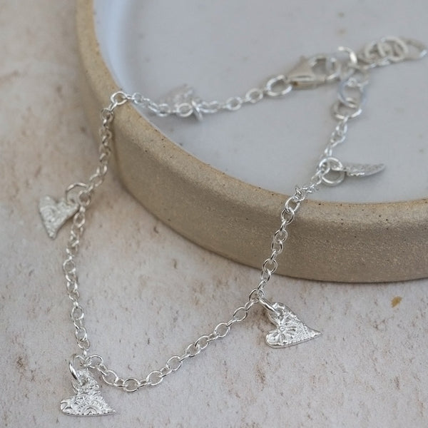 sterling silver textured tilted heart charm bracelet