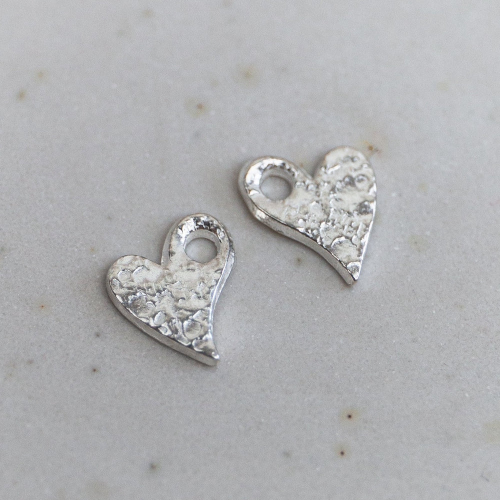 
                  
                    sterling silver textured tilted heart charms
                  
                