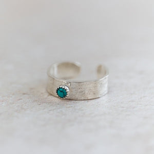 
                  
                    Sterling silver and semi precious turquoise birthstone toe ring handmade by Lucy Kemp Jewellery
                  
                