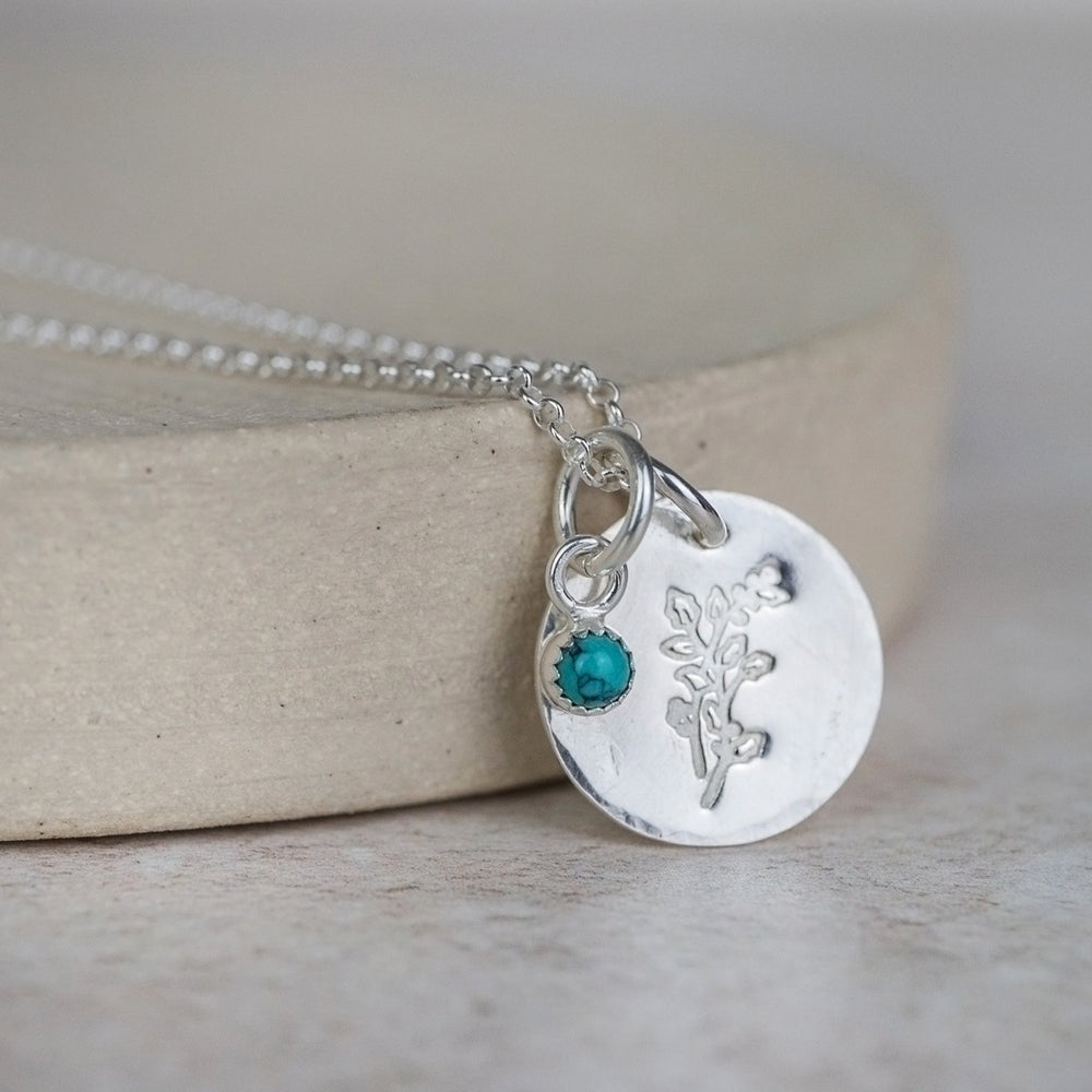 sterling silver hand stamped birth month flower with semi precious birthstone cluster pendant handmade by Lucy Kemp Jewellery - December - holly with turquoise image