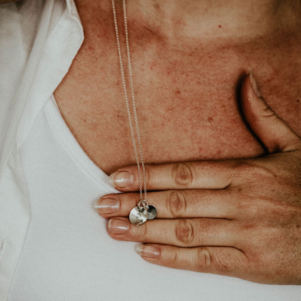 Sterling silver and boho birthstone pendant handmade by Lucy Kemp Jewellery - held image