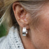sterling silver marble textured hoops handmade by Lucy Kemp Jewellery - worn image