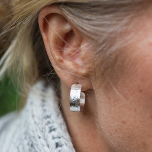 
                  
                    sterling silver marble textured hoops handmade by Lucy Kemp Jewellery - worn image
                  
                