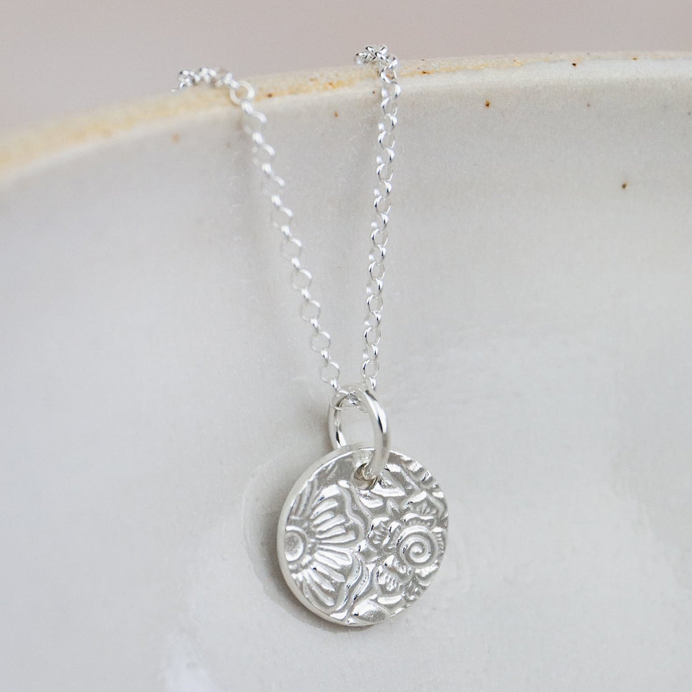 
                  
                    sterling silver small textured circle pendant by Lucy Kemp Jewellery 
                  
                