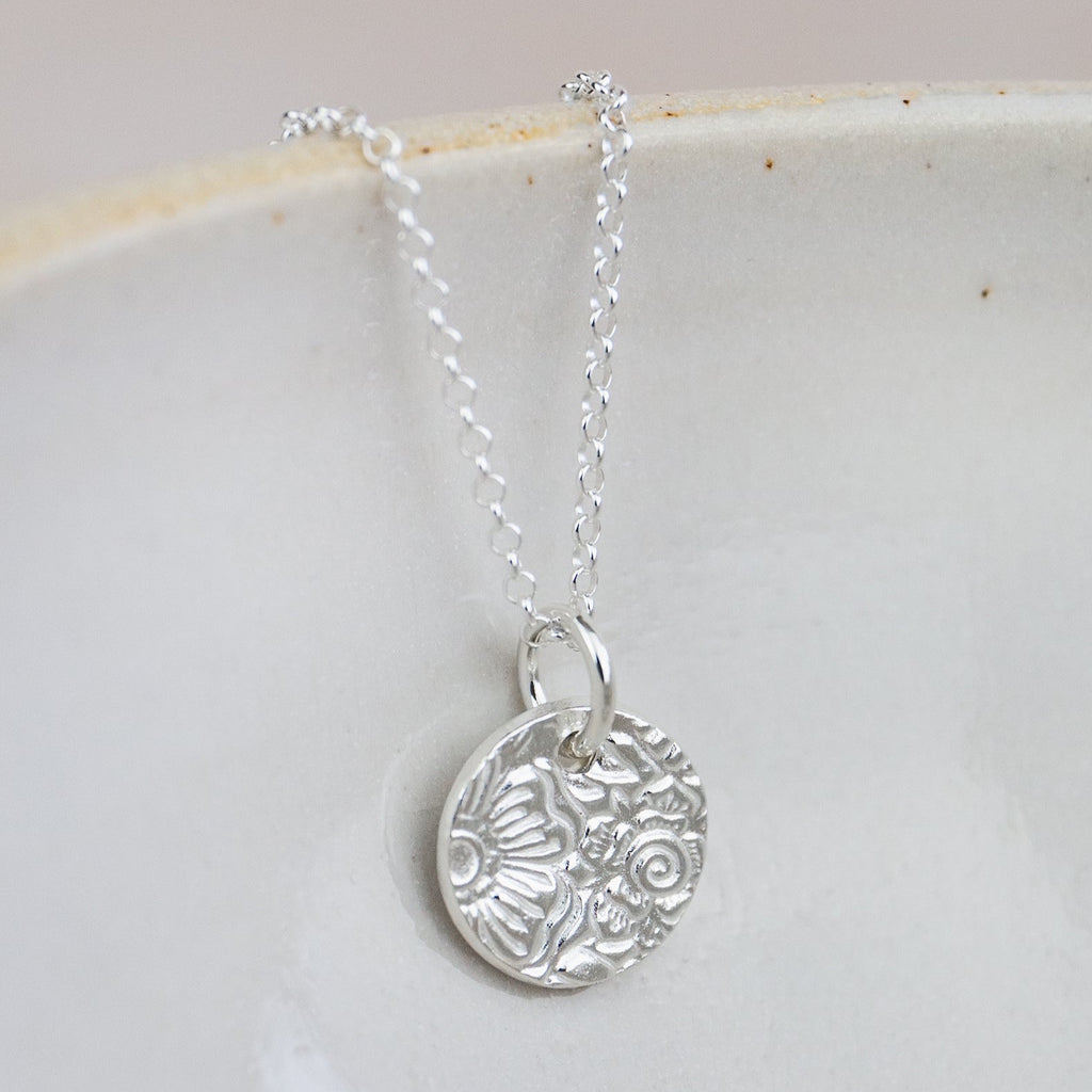 sterling silver small textured circle pendant by Lucy Kemp Jewellery 