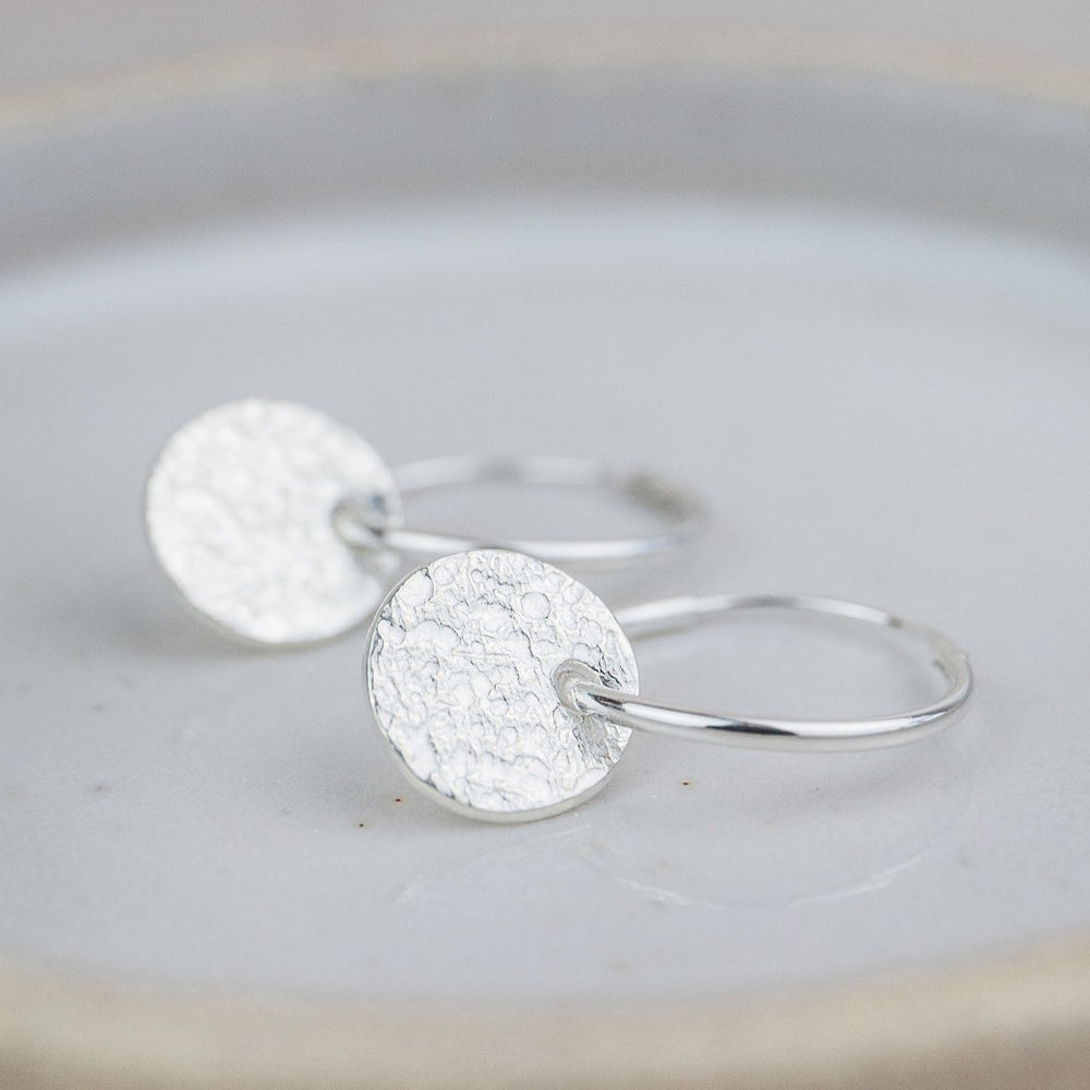 
                  
                    sterling silver textured circle charm sleeper hoops
                  
                