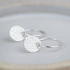 sterling silver textured circle charm sleeper hoops