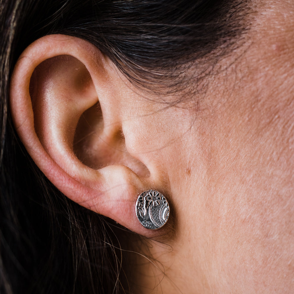 
                  
                    sterling silver textured circle studs by Lucy Kemp Jewellery  worn
                  
                