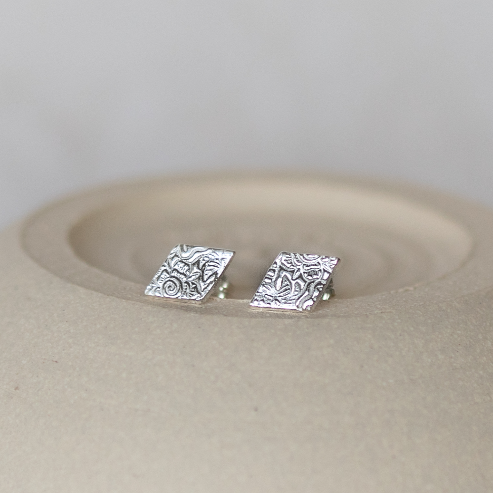 
                  
                    Sterling silver textured diamond studs by Lucy Kemp Jewellery
                  
                