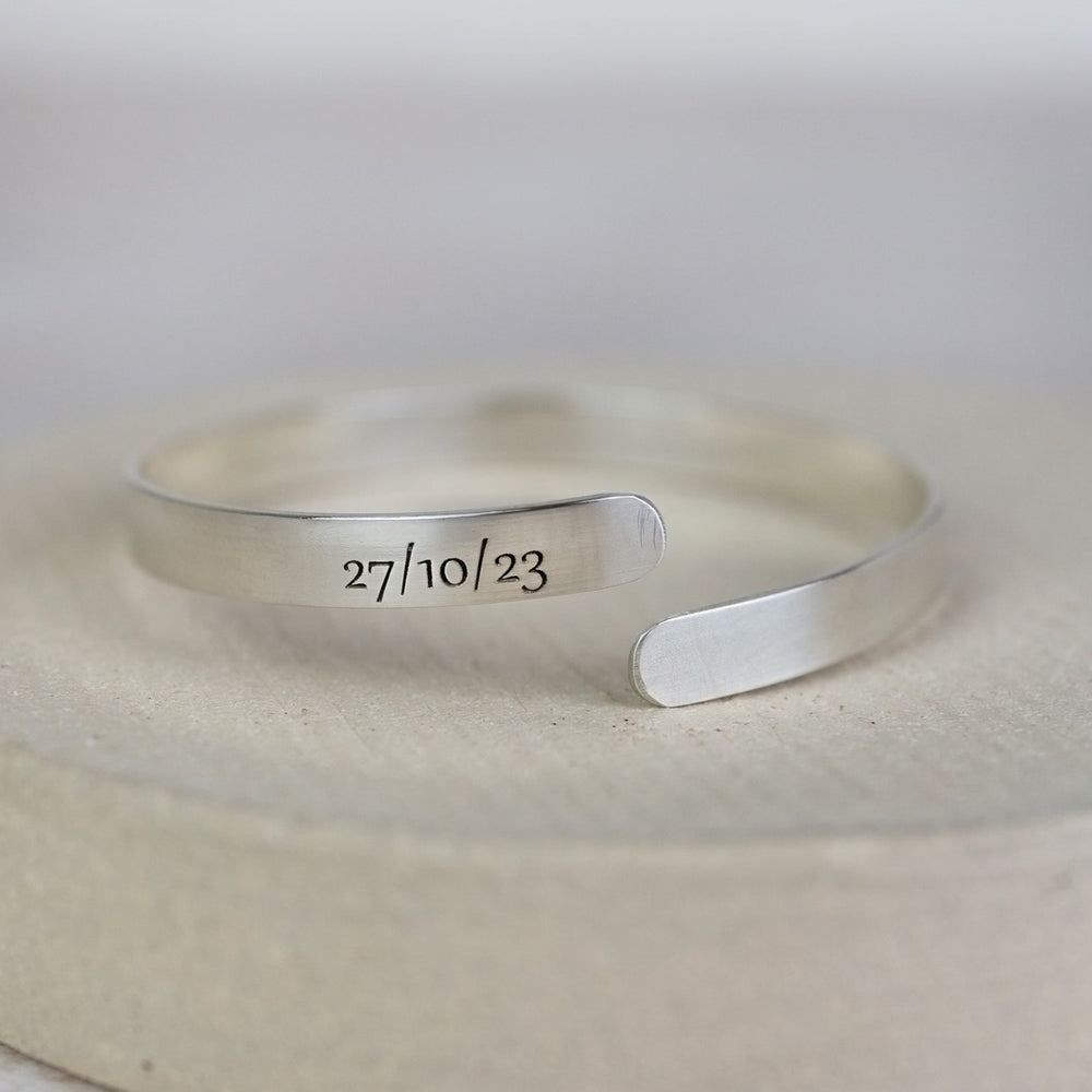 
                  
                    sterling silver engraved christening bangle for children handmade by Lucy Kemp Jewellery - new font
                  
                