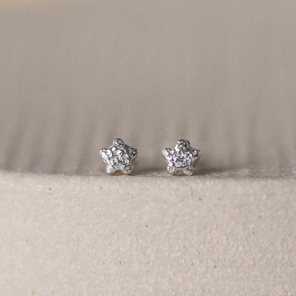 
                  
                    sterling silver textured mini flower studs
                  
                
