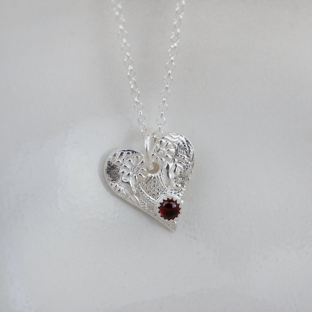 
                  
                    garnet heart birthstone pendant by Lucy Kemp Jewellery 
                  
                