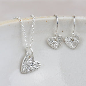 
                  
                    sterling silver small textured heart pendant and earrings set by Lucy Kemp Jewellery
                  
                