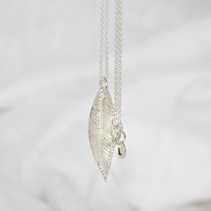 
                  
                    sterling silver textured palm leaf pendant by Lucy Kemp Jewellery
                  
                