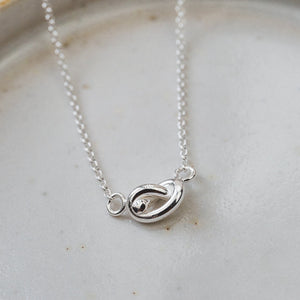 
                  
                    sterling silver love knot necklace by Lucy Kemp Jewellery 
                  
                