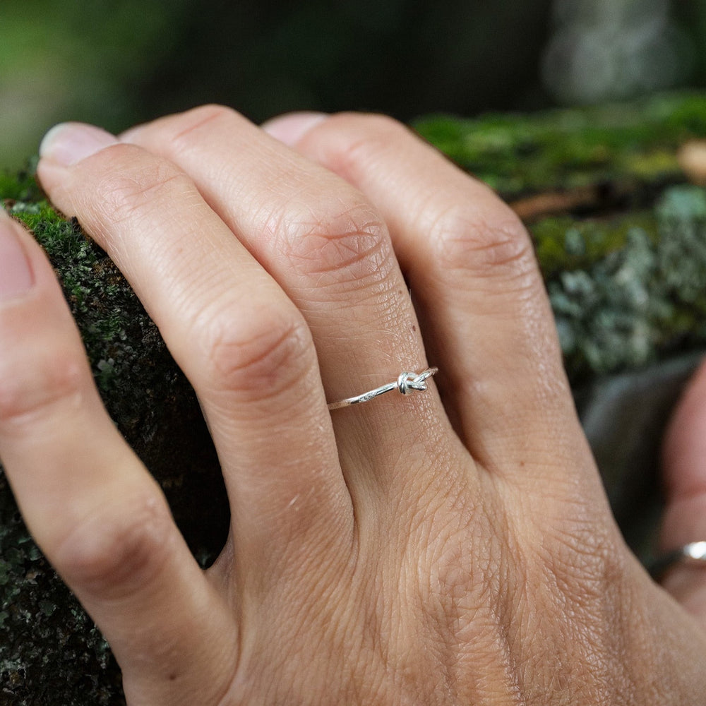 
                  
                    sterling silver love knot ring handmade by Lucy Kemp Jewellery - worn image
                  
                