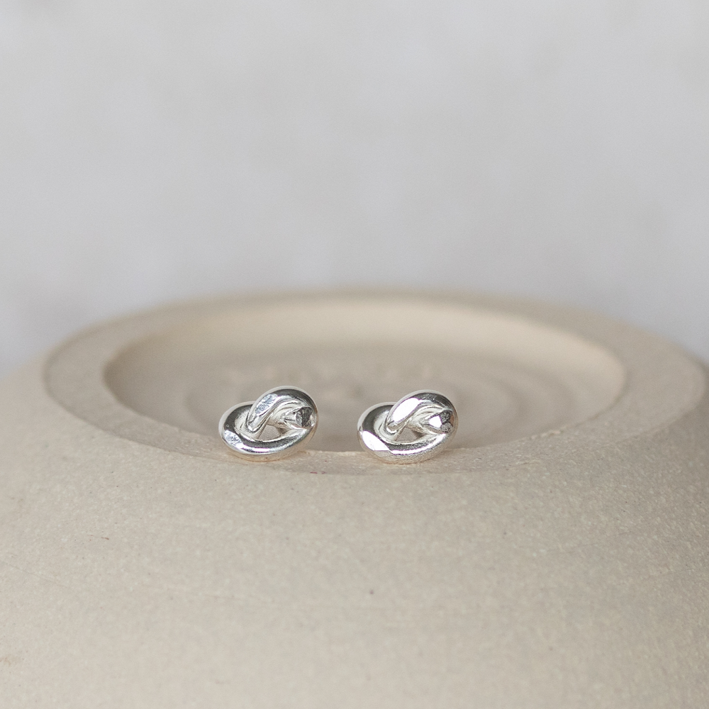 
                  
                    sterling silver love knot studs made with eco wire by Lucy Kemp Jewellery
                  
                