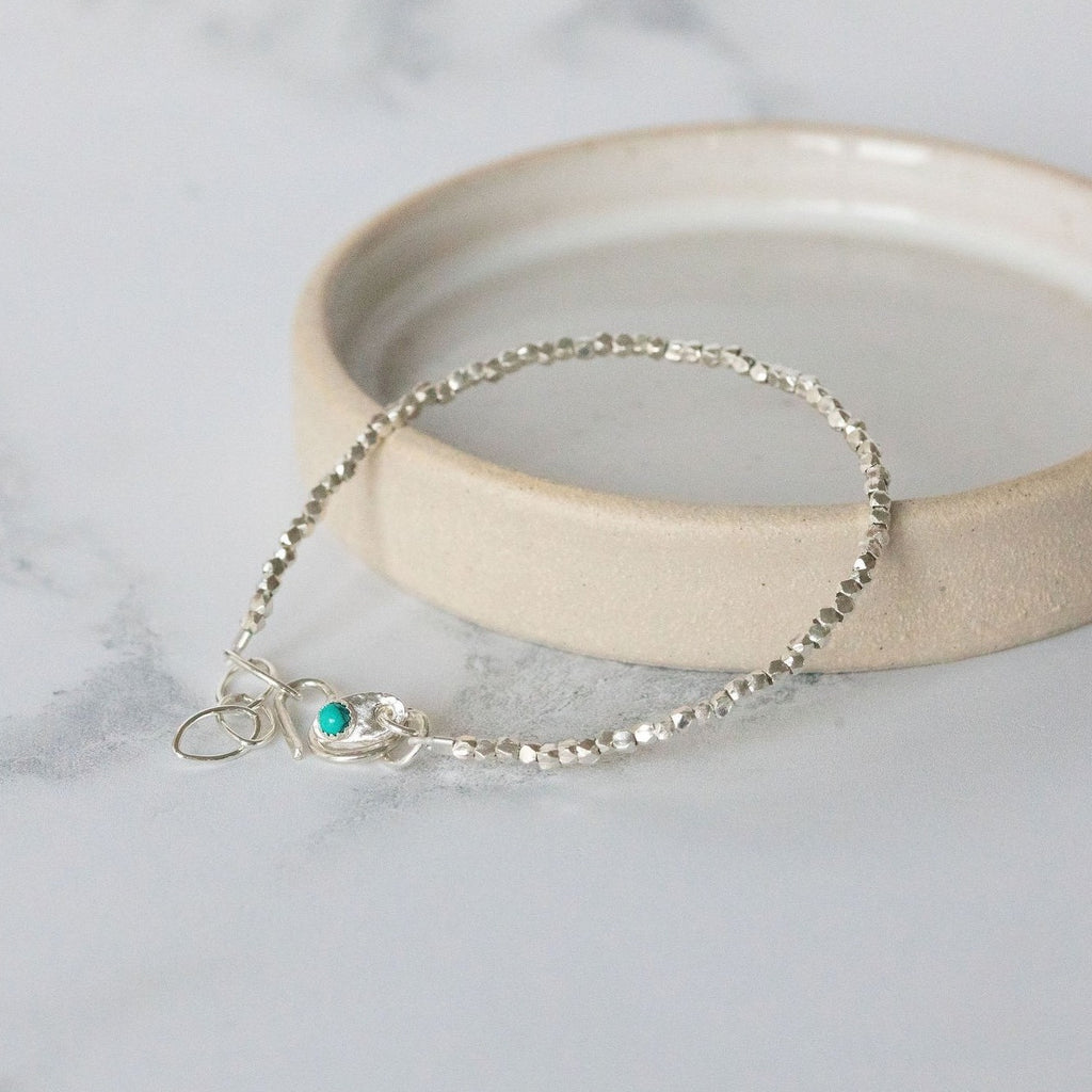sterling silver mini nugget birthstone bracelet handmade by Lucy Kemp Jewellery with turquoise