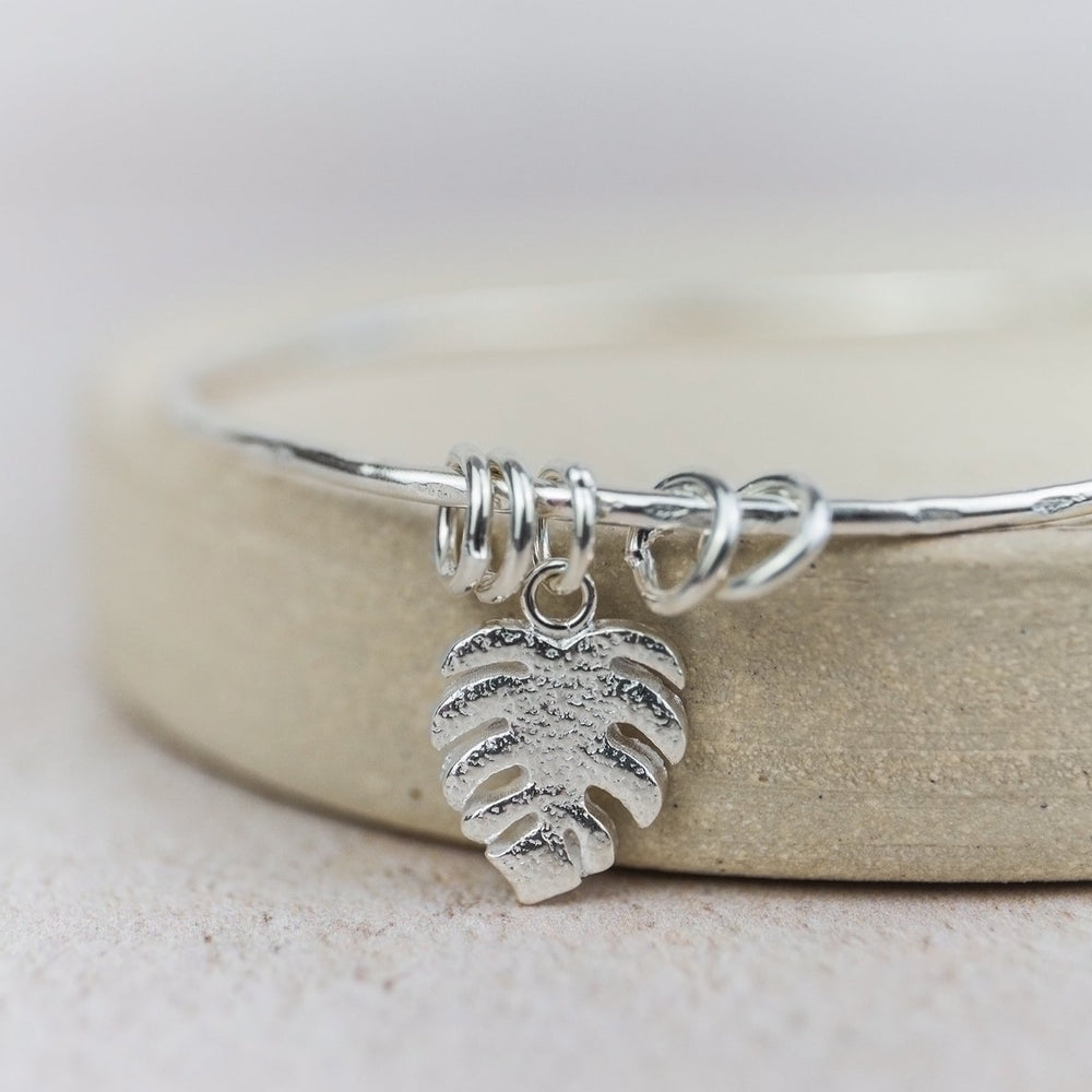 sterling silver monstera charm bangle handmade by Lucy Kemp Jewellery 