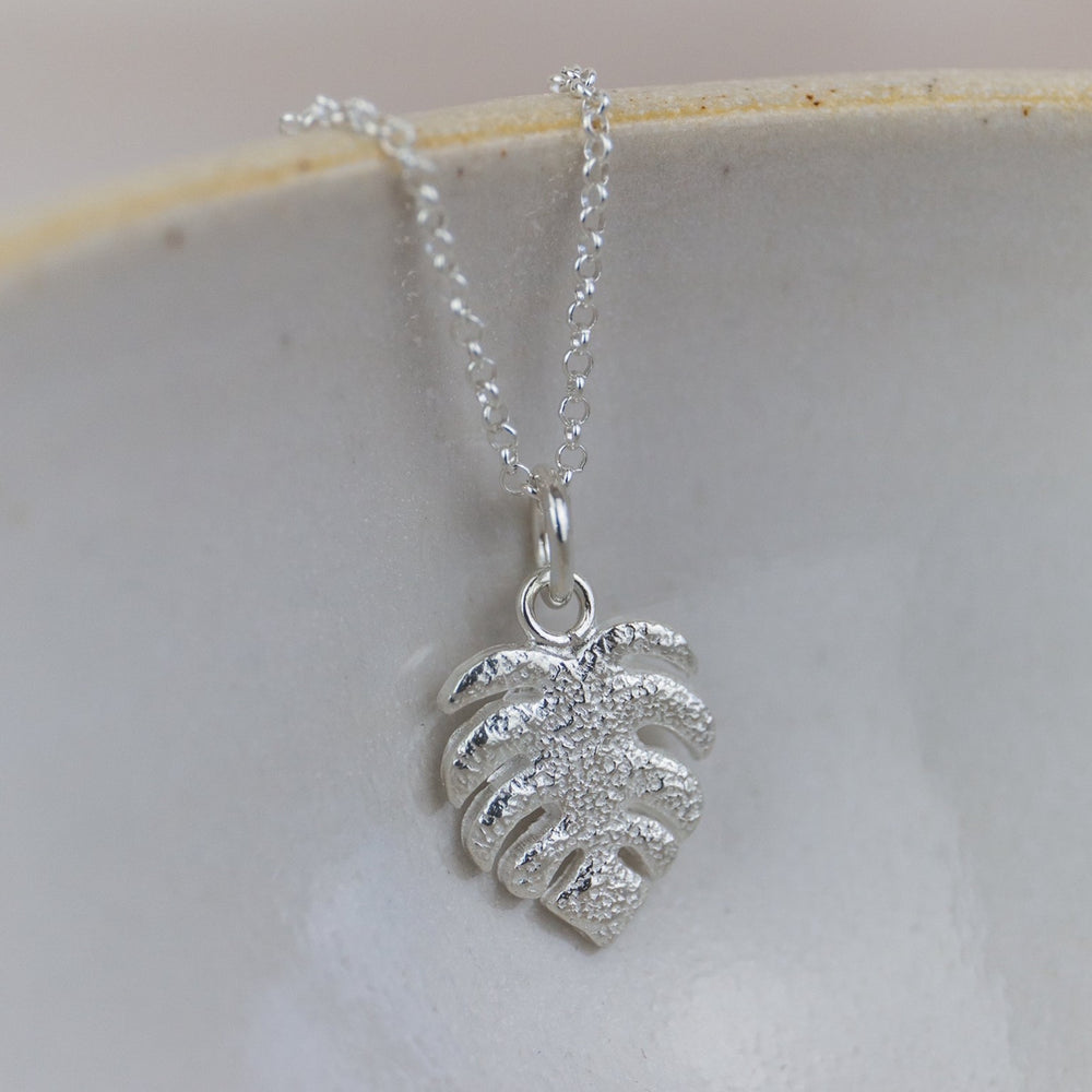 
                  
                    handmade sterling silver monstera pendant by Lucy Kemp Jewellery
                  
                